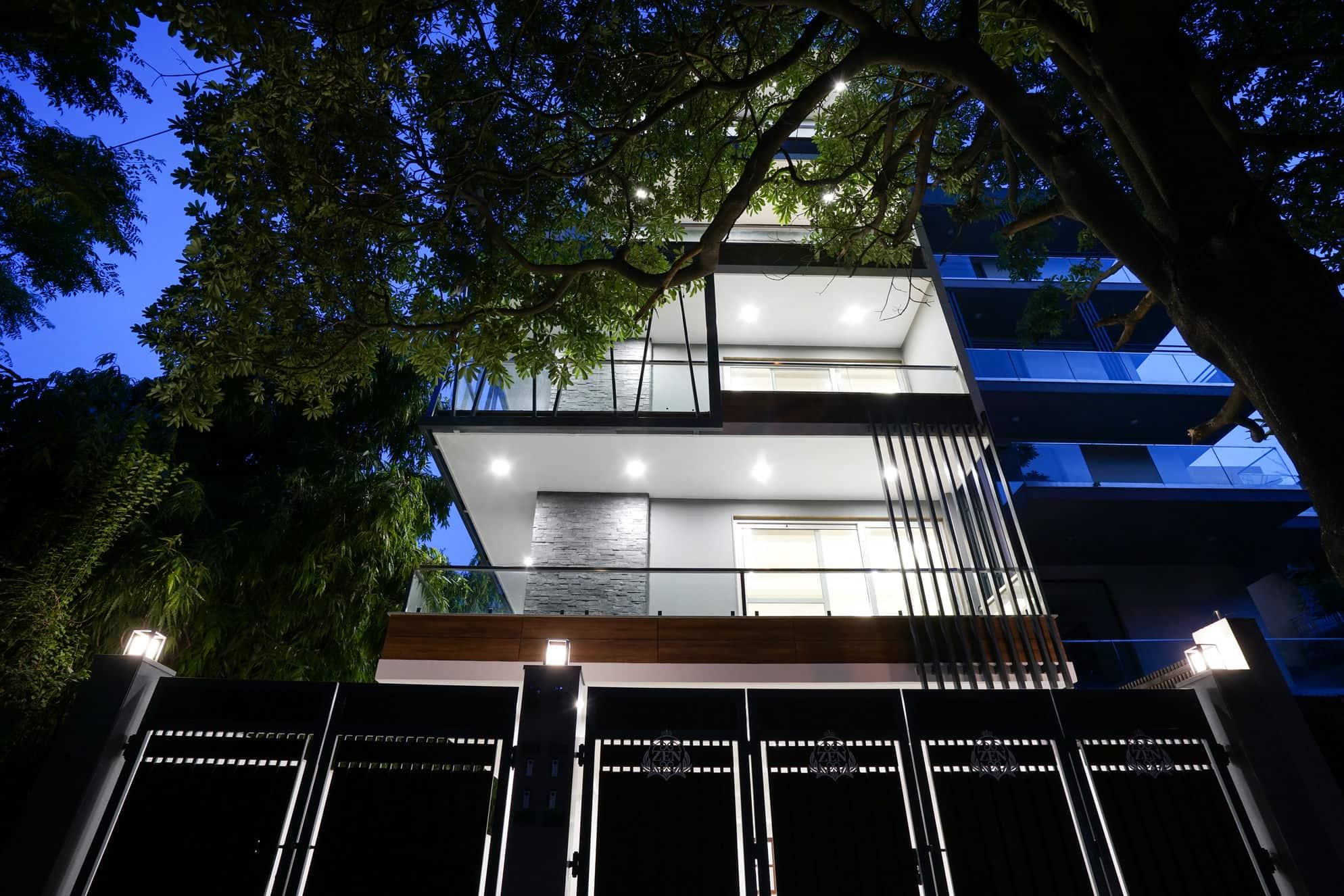 B-21 Geetanjali Enclave building facade at dusk