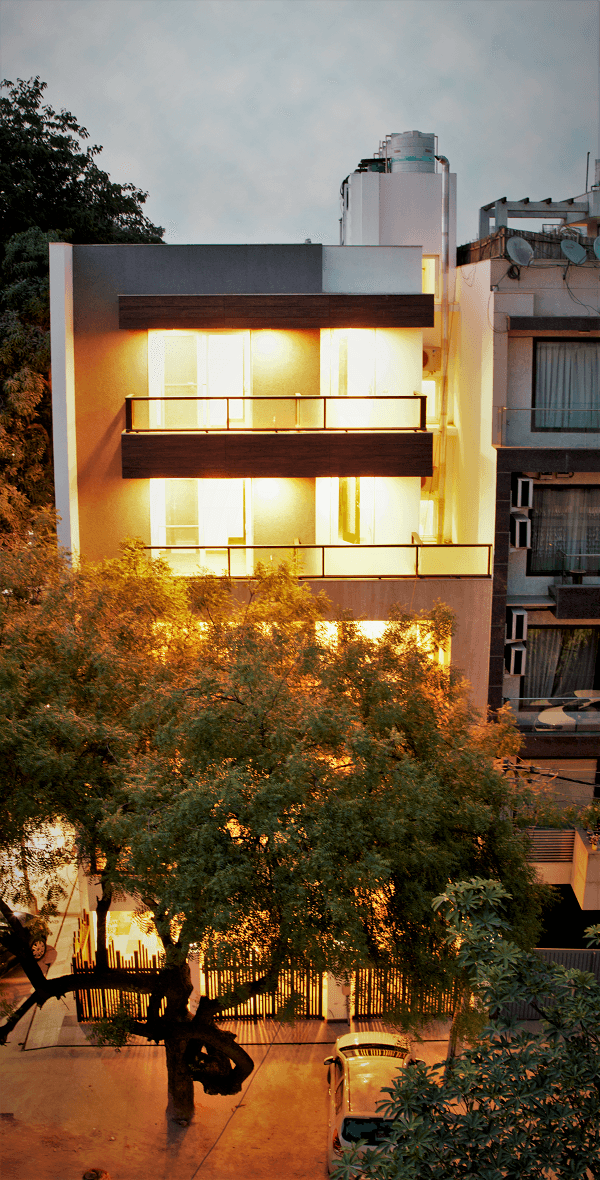Panchsheel Enclave building facade at dusk